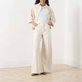 Model wearing Max Mara Weekend ecru cotton jacket, styled with matching wide-leg trousers and a white T-shirt.