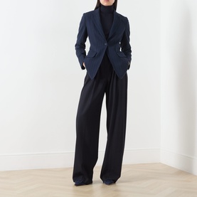 Model wearing Max Mara Main ultramarine wool blazer jacket, styled with black wide-leg trousers and black turtleneck.