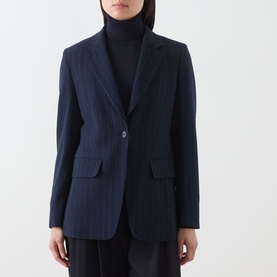 Model wearing Max Mara Main ultramarine pinstripe wool blazer, single button fastening, styled with black turtleneck and trousers