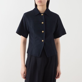 Model wearing Max Mara Main ultramarine cotton short-sleeve jacket with gold buttons, styled with matching wide-leg trousers.