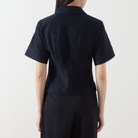 Model wearing Max Mara Main ultramarine cotton short-sleeve jacket, rear view, styled with matching wide-leg trousers.