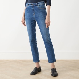 Model wearing Max Mara Weekend Lana Cropped Straight Leg Jeans in navy medium denim, styled with black loafers and a navy top.