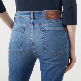 Model wearing Max Mara Weekend Lana Cropped Straight Leg Jeans in navy medium, rear view showing logo badge and faded denim details