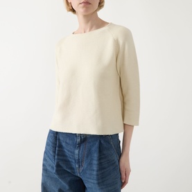 Model wearing Max Mara Weekend Addotto Knit Sweater in ecru with round neckline and three-quarter sleeves, styled with blue jeans