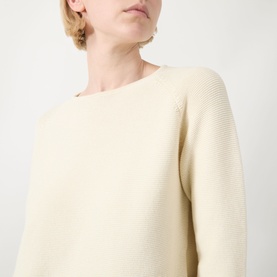 Model wearing Max Mara Weekend Addotto Knit Sweater in ecru, featuring round neckline and three-quarter-length sleeves in cotton knit