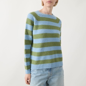 Model wearing Max Mara Weekend Ghiacci Stripe Sweater in blue and green stripe, crew neck, long raglan sleeves, styled with light-wash jeans