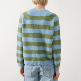 Model wearing Max Mara Weekend Ghiacci Stripe Sweater in blue and green stripes, crew neck, long raglan sleeves, ribbed hem, styled with light-wash