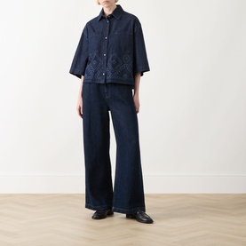 Model wearing Max Mara Weekend Alare Bandana Shirt in navy denim, with wide-leg dark jeans and black leather shoes.
