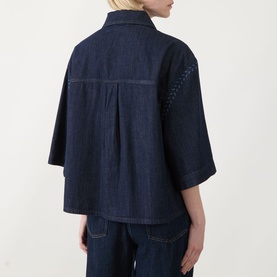 Model wearing Max Mara Weekend Alare Bandana Shirt in navy denim, back view showing box pleat, three-quarter sleeves and dropped shoulders, styled