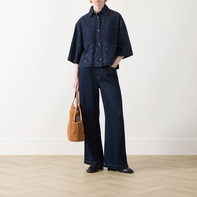 Model wearing Max Mara Weekend Alare Bandana Shirt in Navy Denim with wide-leg dark jeans, carrying a tan suede shoulder bag