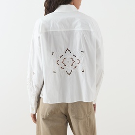 Model wearing Max Mara Weekend Ariano Lace Cut-Out Blouse in White Lace, back view showing geometric lace cut-out and embroidered detail