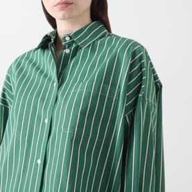 Model wearing Max Mara Weekend Onore Stripe Shirt in Green Big Stripe, oversized fit with pointed collar, chest pocket, and long sleeves visible.