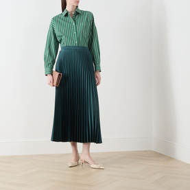 Model wearing Max Mara Weekend Onore Stripe Shirt in Green Big Stripe with dark teal pleated midi skirt and cream slingback heels.