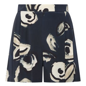 Navy blue wide-leg shorts with abstract cream and black floral brushstroke print, tailored fit, side seam detail