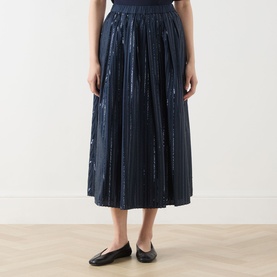 Model wearing Max Mara Weekend Fiordi Embellished Flared Skirt in navy with sequin detailing, midi length, styled with black ballet flats.
