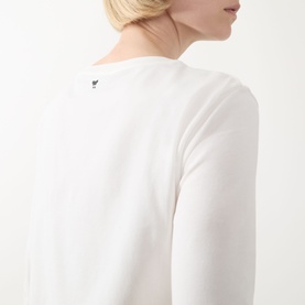 Model wearing Max Mara Weekend Multia Logo Top in white, back view showing butterfly logo detail and three-quarter-length sleeves.