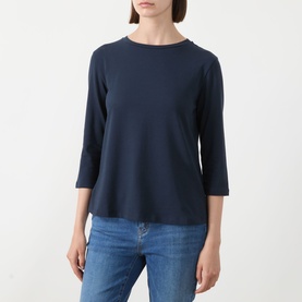 Model wearing Max Mara Weekend Multia Stretch Top in navy, featuring round neckline and three-quarter sleeves, styled with blue jeans