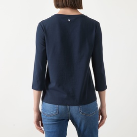 Model wearing Max Mara Weekend Multia Stretch Top in navy, rear view showing butterfly logo, three-quarter sleeves and straight hem, styled with blue