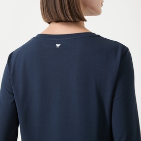 Model wearing Max Mara Weekend Multia Stretch Top in navy, rear view showing white butterfly logo detail and three-quarter-length sleeves