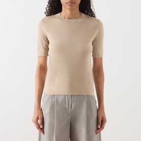 Model wearing Max Mara Weekend Tapioca Fine-Knit Sweater in sand, crew neck, short sleeves, styled with grey wide-leg trousers