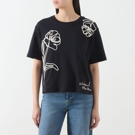 Model wearing Max Mara Weekend Sala Flower Boxy T-Shirt in black with white floral embroidery and branded lettering, short sleeves, round neck.