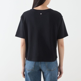 Model wearing Max Mara Weekend Sala Flower Boxy T-Shirt in Black Flowers, rear view, styled with blue denim jeans
