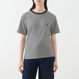 Model wearing Max Mara Weekend Venaco Logo Striped T-Shirt in black, crew neck, short sleeves, paired with dark denim jeans.