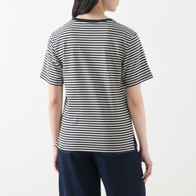 Model wearing Max Mara Weekend Venaco Logo Striped T-Shirt in black and white horizontal stripes, crew neck, short sleeves, styled with navy trousers.