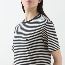 Model wearing Max Mara Weekend Venaco Logo Striped T-Shirt in black, crew neckline, short sleeves, black and white horizontal stripes with small logo