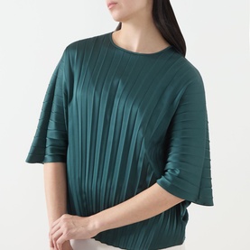 Model wearing Max Mara Weekend Aureo Pliss&eacute; Top in dark green with round neckline, kimono sleeves, and diagonal pliss&eacute; fabric detail.
