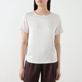Model wearing Max Mara Weekend Gilbert Solid Blouse in ivory, featuring crew neckline, short sleeves and satin finish, styled with dark brown trousers
