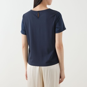Model wearing Max Mara Weekend Gilbert Solid Blouse in navy, rear keyhole detail, short sleeves, satin finish, styled with cream wide-leg trousers.