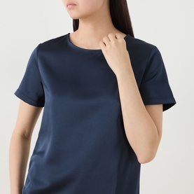 Model wearing Max Mara Weekend Gilbert Solid Blouse in navy, satin finish, crew neckline, short sleeves, straight hem