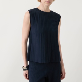 Model wearing Max Mara Weekend Ere Pliss&eacute; Top in navy, sleeveless with round neckline and pliss&eacute; texture, styled with matching navy trousers