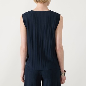 Model wearing Max Mara Weekend Ere Pliss&eacute; Top in navy, sleeveless with all-over pliss&eacute; pleating, shown from behind, styled with navy wide-leg