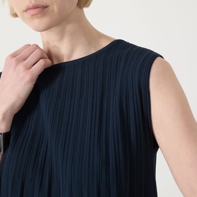Model wearing Max Mara Weekend Ere Pliss&eacute; Top in navy, sleeveless with round neckline and fine pliss&eacute; texture throughout.