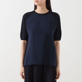 Model wearing Max Mara Main Golfo Two-Tone Knitted Sweater in Ultramarine, crew neck, contrasting black short sleeves, chest patch pocket