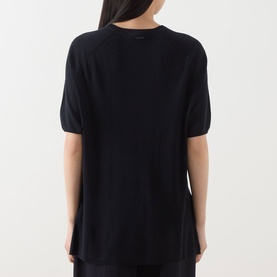 Model wearing Max Mara Main Golfo Two-Tone Knitted Sweater in Ultramarine, back view showing rear logo detail and high-low hem