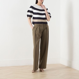 Model wearing Max Mara Main Voto Striped Sweater in ultramarine, crew neck, kimono sleeves, styled with wide-leg khaki trousers
