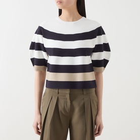Model wearing Max Mara Main Voto Striped Sweater in ultramarine, navy and cream bold stripes, cropped length with puff sleeves, styled with khaki