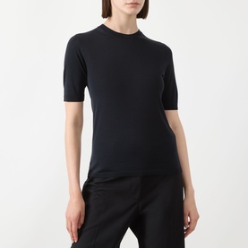Model wearing Max Mara Main Aceti Silk-Cashmere Knit Sweater in Ultramarine, crew neck, short sleeves, fine-knit finish, styled with black trousers