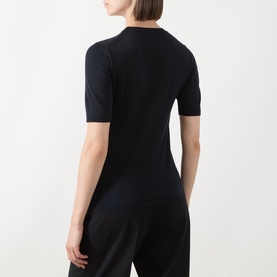 Model wearing Max Mara Aceti Silk-Cashmere Knit Sweater in Ultramarine, short sleeves, crew neck, fine-knit finish, styled with wide-leg trousers,