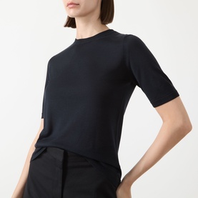 Model wearing Max Mara Aceti Silk-Cashmere Knit Sweater in ultramarine, crew neck, short sleeves, fine-knit, styled with black trousers