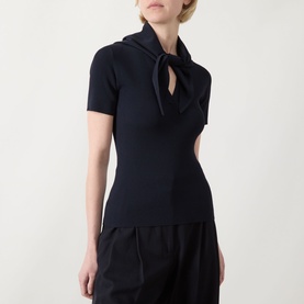 Model wearing Max Mara Main Palmeti Scarf Top in Ultramarine, ribbed with short sleeves and detachable tie scarf at neck, styled with black wide-leg