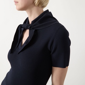 Model wearing Max Mara Main Palmeti Scarf Top in Ultramarine, ribbed structure, short sleeves with tied detachable scarf at notched neckline