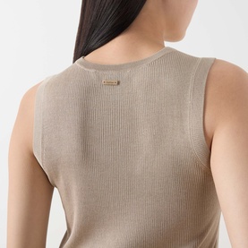 Model wearing Max Mara Main Ginseng Knitted Vest in stone, showing ribbed back detail and gold logo tab at neckline