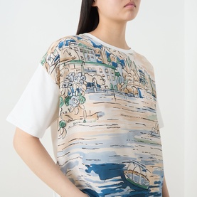 Model wearing Max Mara Weekend Terzo Silk Waterscape T-Shirt in light blue with scenic waterscape print, crew neck, short sleeves, white jersey back