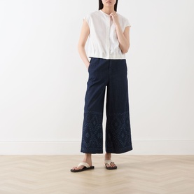 Model wearing Max Mara Weekend Lampada Bandana Print Culottes in Navy Denim, wide-leg cropped fit with bandana print detail, styled with white top