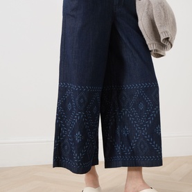 Model wearing Max Mara Weekend Lampada Bandana Print Culottes in navy denim, wide-leg cropped fit with bandana print detailing on lower legs