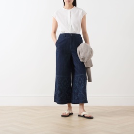 Model wearing Max Mara Weekend Lampada Bandana Print Culottes in Navy Denim, wide-leg cropped style, paired with white top and flat sandals.